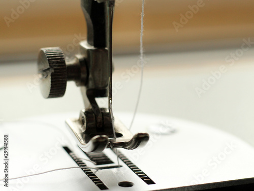 Sewing machine, needle with thread macro