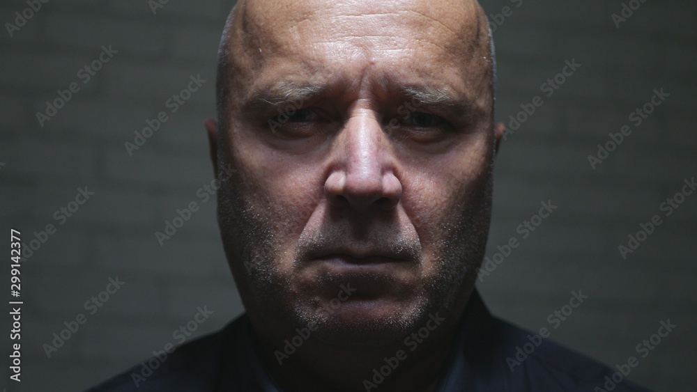 Image with a Disappointed Man in a Dark Room with a Sad Face Image with a Disappointed Man in a Dark Room with a Sad Face