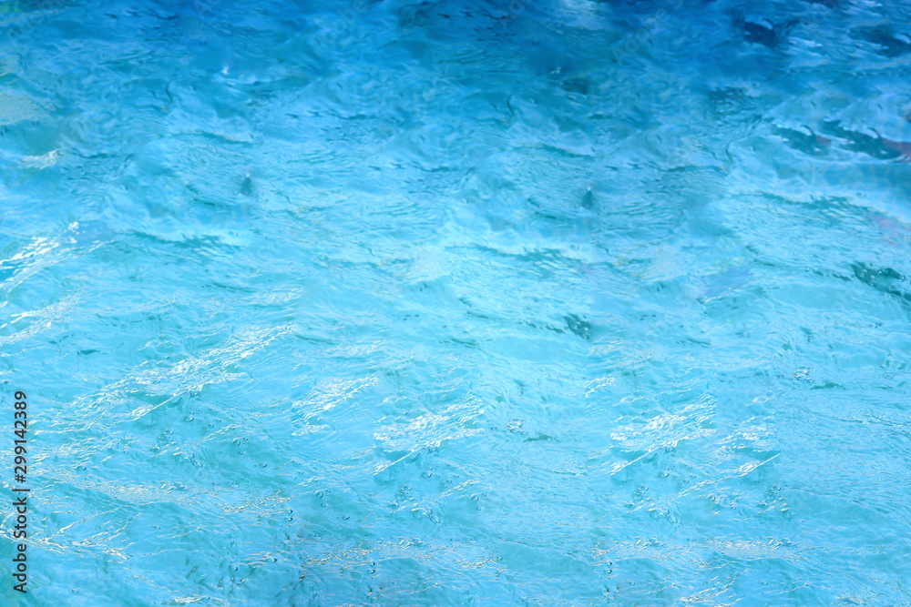 surface of water in swimming pool, refreshing blue swimming pool.