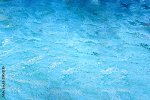 surface of water in swimming pool, refreshing blue swimming pool.