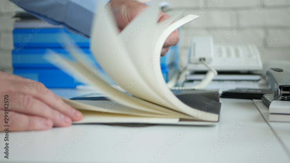 Image with a Businessman Working in the Office Browse Agenda Pages Image with a Businessman Working in the Office Browse Agenda Pages
