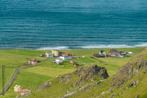 Farm houses at Uttakleiv Beach in Norway photo