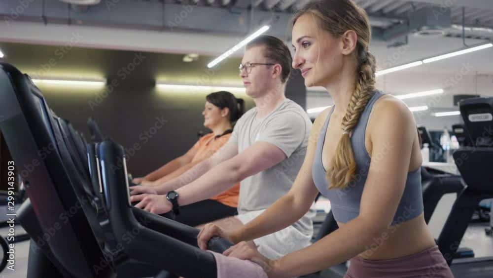 People on fitness bikes with their instructor People on fitness bikes with their instructor