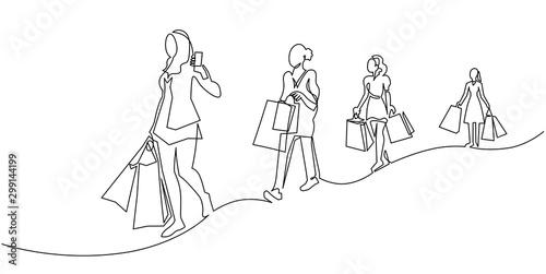Continuous one line drawing women with shopping bags in their hands. Fashion girls on New Year's sale