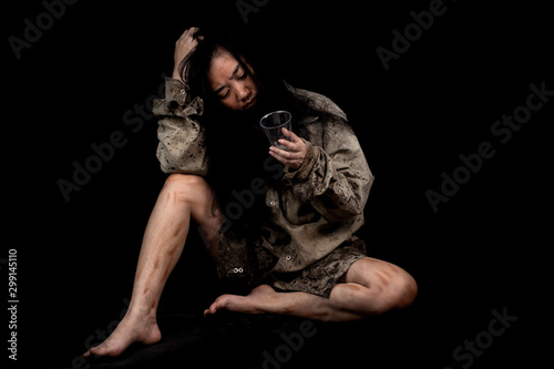 Young and dirty beggar asking for some money