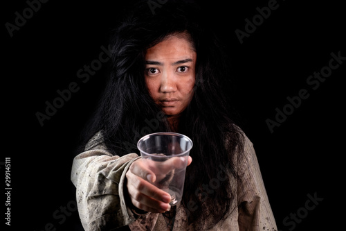 Young and dirty beggar asking for some money