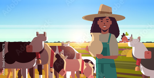 milkwoman holding pail with fresh milk female farmer standing near herd of cows grazing on grassy field eco farming husbandry concept sunset landscape background closeup horizontal portrait vector