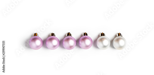 White and pink Christmas decorations lie in a row on a white background, minimal style, flat lay.