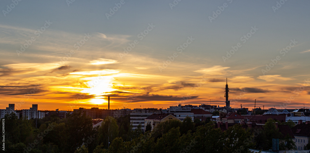 Naklejka premium sunset over city