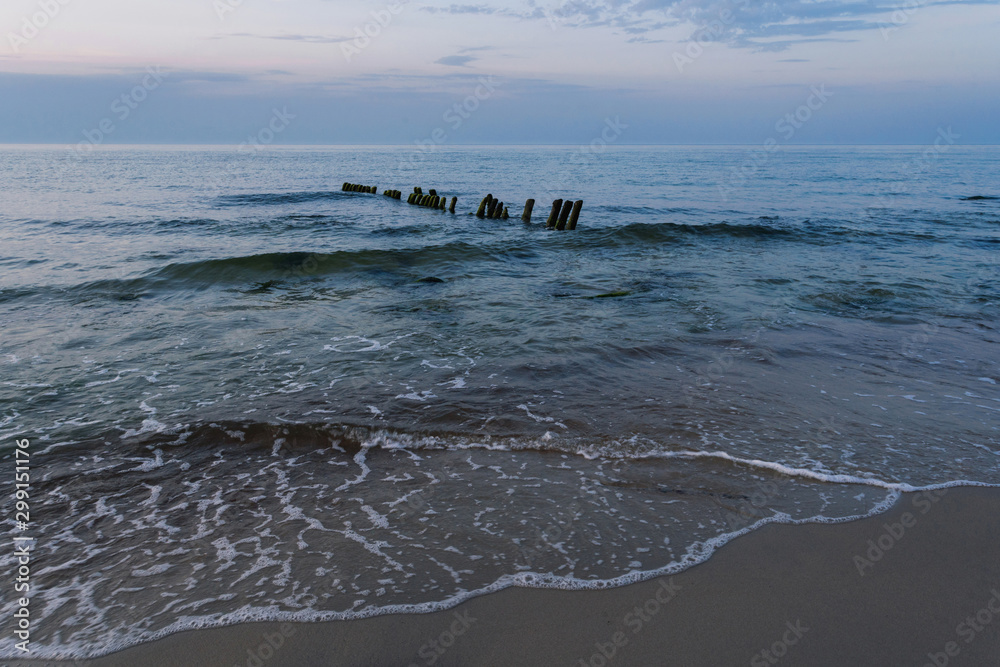 Fototapeta premium twilight, beautiful azure waves on the coast