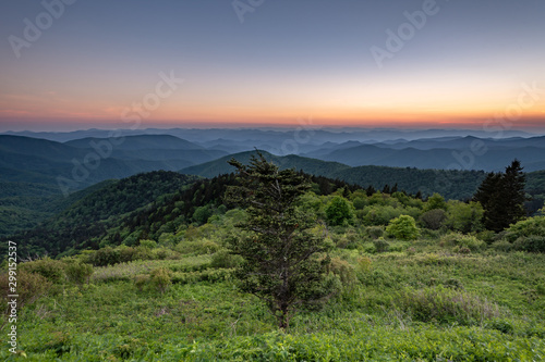 View of sunset from Cowee Mountain Overlook on Blue Ridge Parkway in summer. 