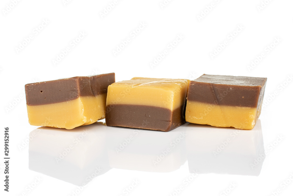 Group of three whole sweet brown caramel chocolate candy in row isolated on white background Group of three whole sweet brown caramel chocolate candy in row isolated on white background