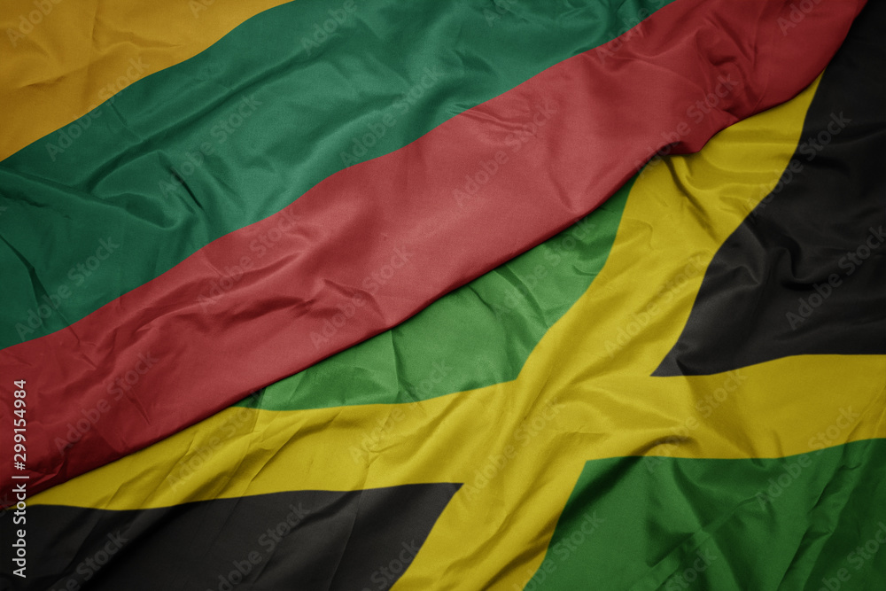 Obraz premium waving colorful flag of jamaica and national flag of lithuania.