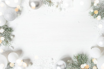 White Christmas background with spruce frosty brunches and Christmas lights
