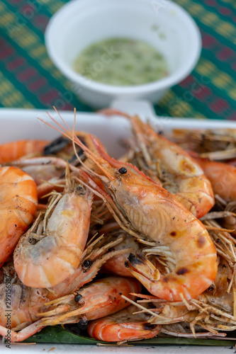 Grilled shrimp in a foam box With seafood sauce