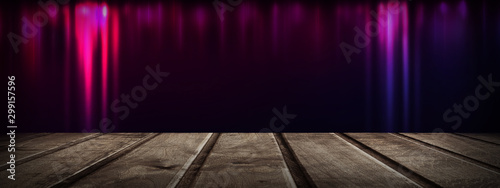 Dark room with a wooden tab...