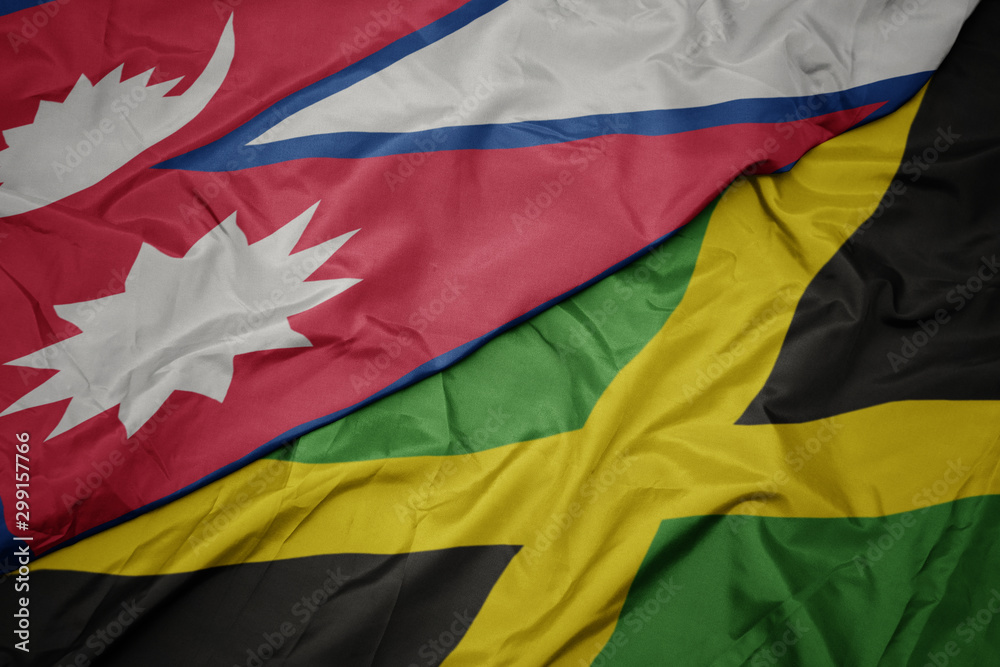 waving colorful flag of jamaica and national flag of nepal. waving colorful flag of jamaica and national flag of nepal.