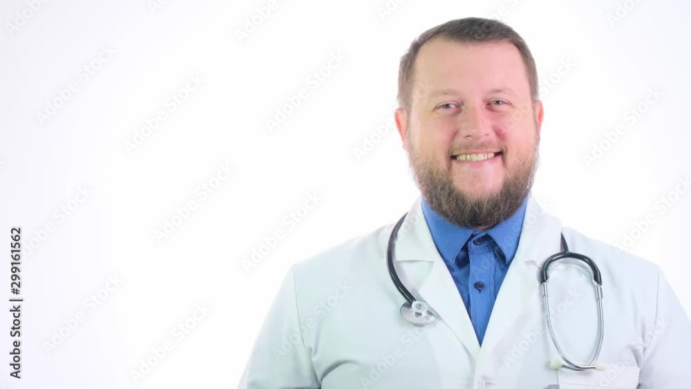 Nice chubby doctor with a beard in a white coat on a white isolated background Nice chubby doctor with a beard in a white coat on a white isolated background