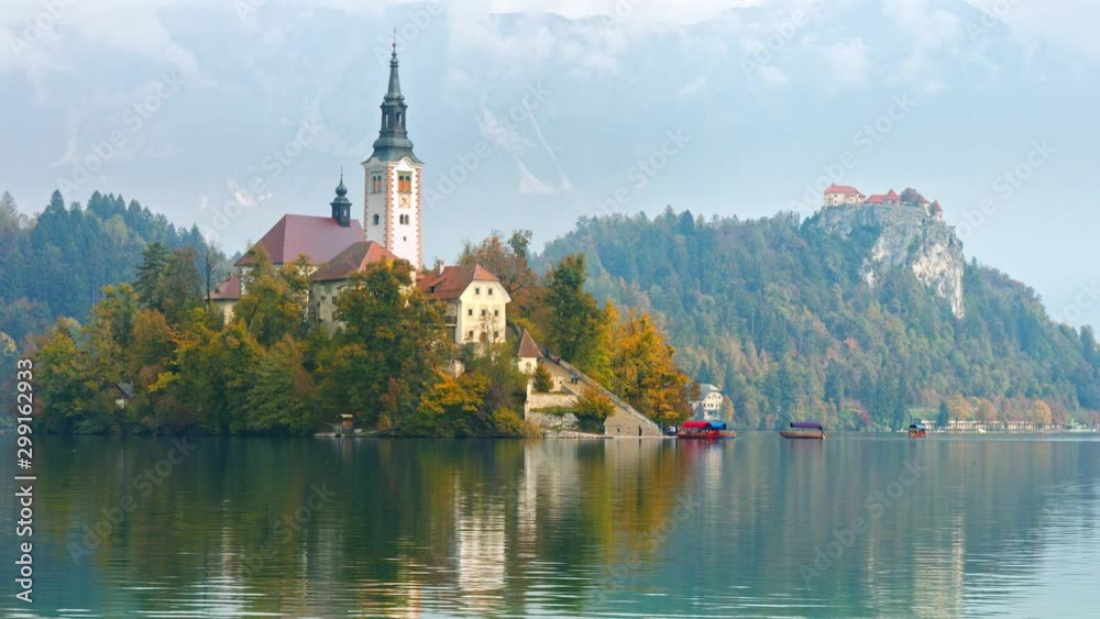 Scenic view of beautiful architecture on island in autumn Lake Bled. 4K footage Scenic view of beautiful architecture on island in autumn Lake Bled. 4K footage