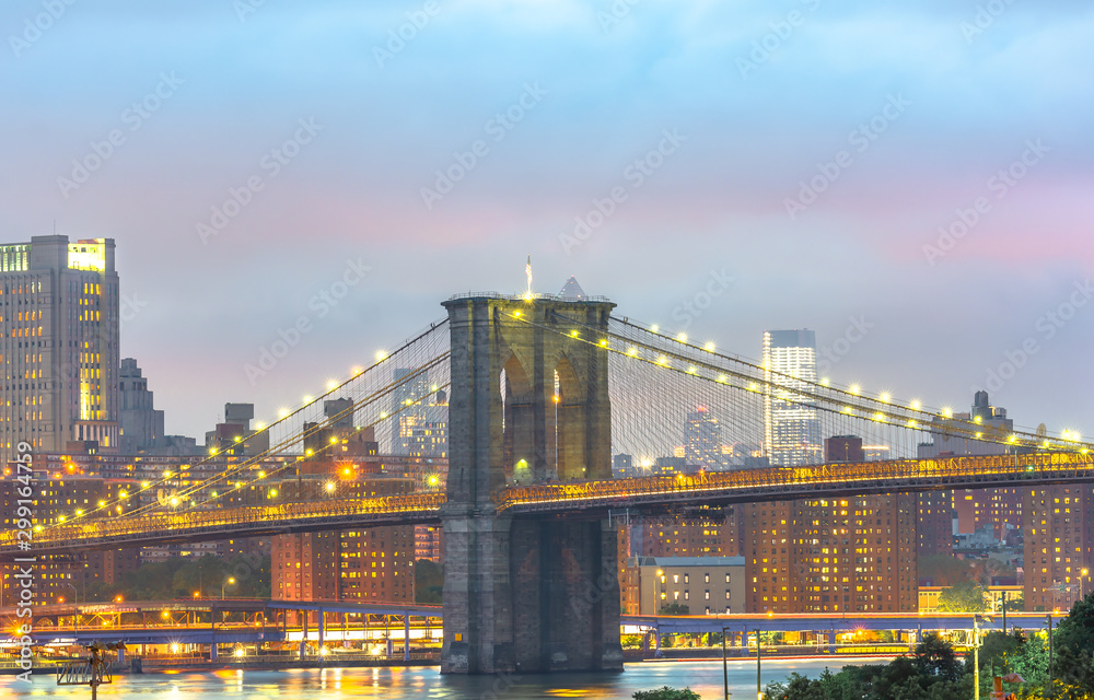 View of Brooklyn Bridge from Brooklyn Heights Promenade in the evening.