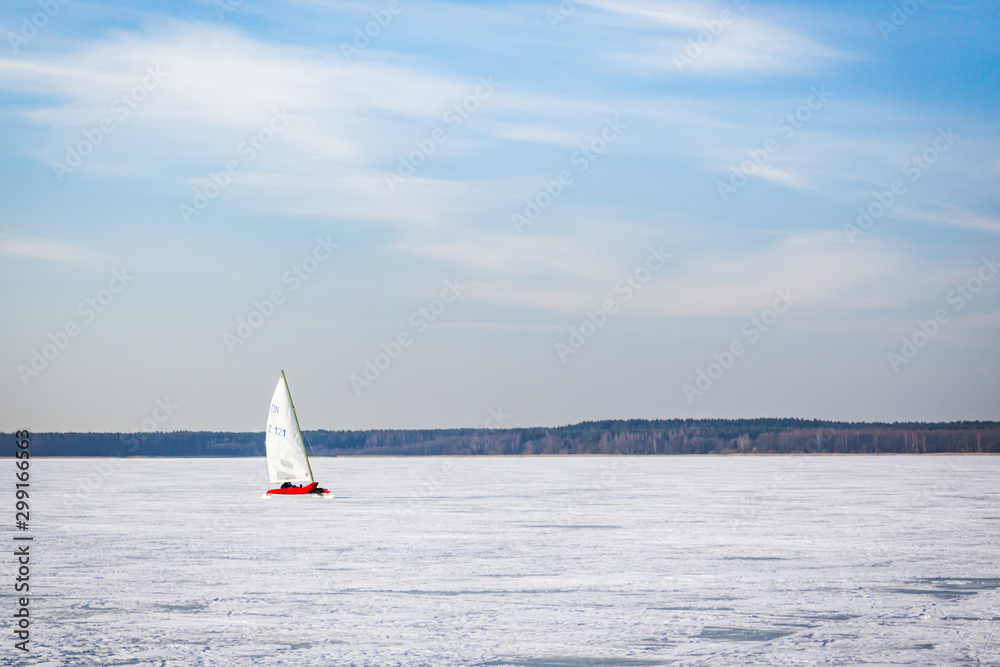 Naklejka premium Sailboat on a frozen lake. Ice iceboating competition. Winter sport.