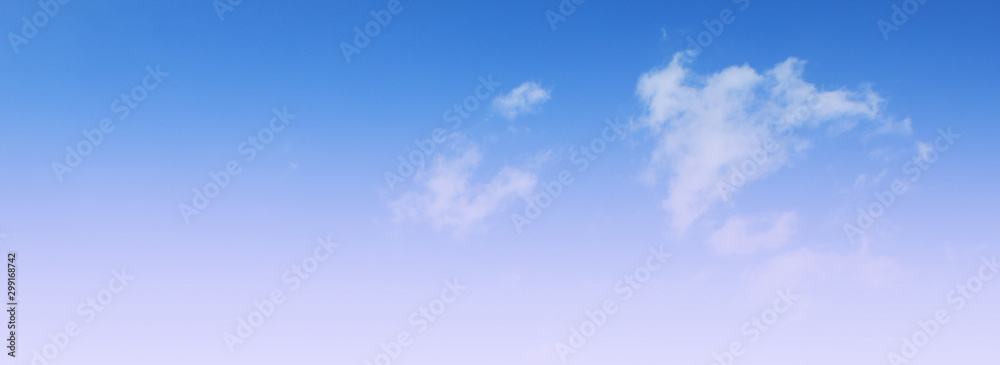 Cloudy sky background. Light blue sky texture. Nature image with sunny skyline view - obrazy, fototapety, plakaty 