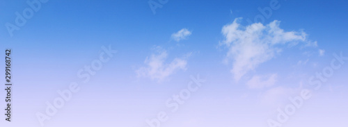 Cloudy sky background. Light blue sky texture. Nature image with sunny skyline view