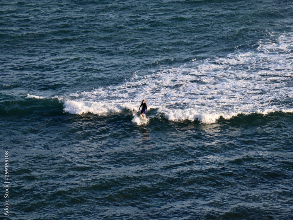 man on surfboard Hawaii 