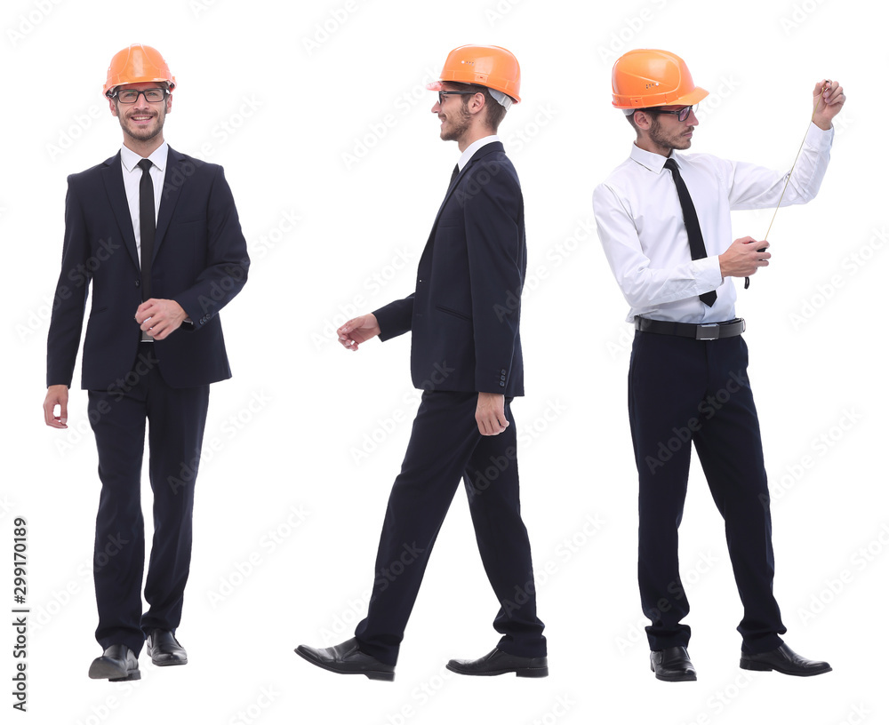 in full growth .a qualified architect in an orange helmet in full growth .a qualified architect in an orange helmet