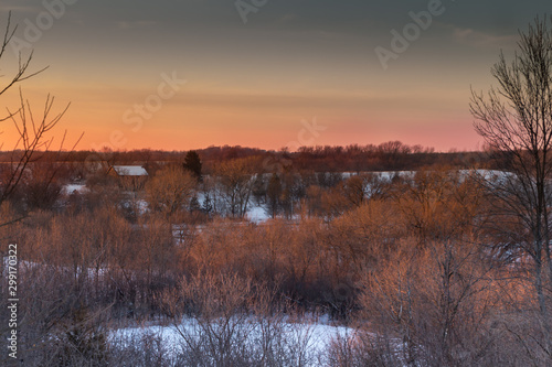 Sunset over snow covered fields