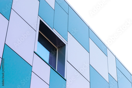 Geometric color elements of the building facade with planes, lines, corners with highlights and reflections for the abstract background and texture of white, turquoise, blue colors. Place for text