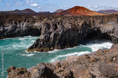 Los Hervideros sight with volcanic rocks and wild sea on Lanzarote island