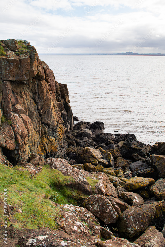 Firth of Forth estuary in Aberdour, Fife. Scenic ocean view. Aberdour is a scenic and historic village on the south coast of Fife, Scotland. Firth of Forth estuary in Aberdour, Fife. Scenic ocean view. Aberdour is a scenic and historic village on the south coast of Fife, Scotland.