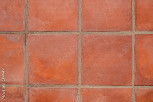 terracotta tiled floor background - terracotta tiles closeup - photo
