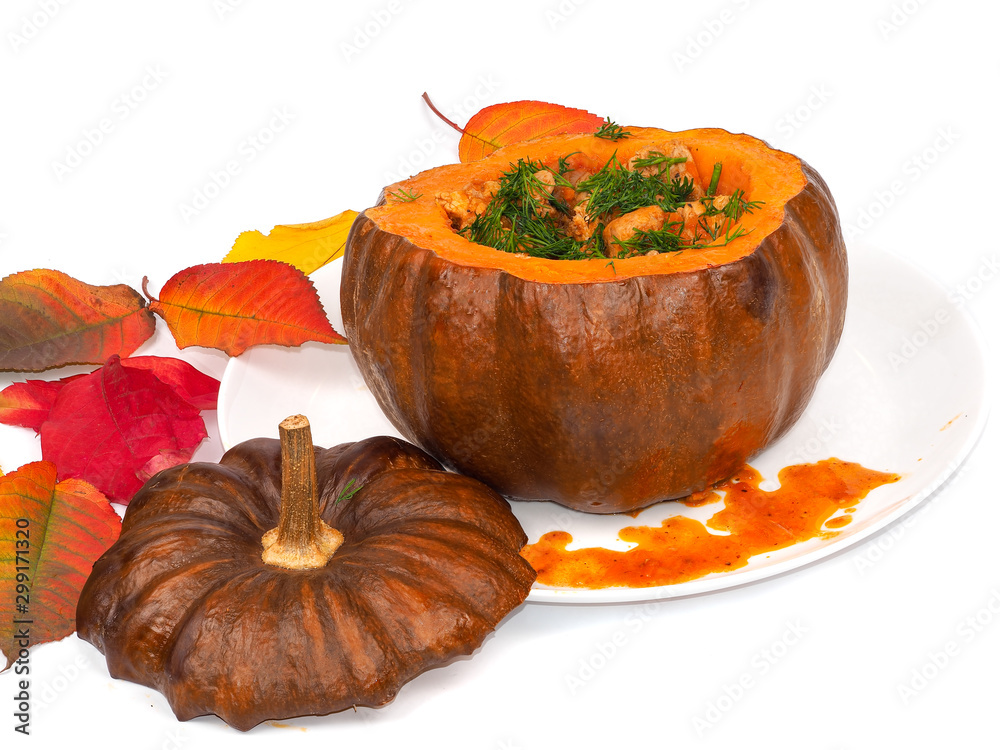 Baked pumpkin with meat, tomato and herbs on a plate Baked pumpkin with meat, tomato and herbs on a plate