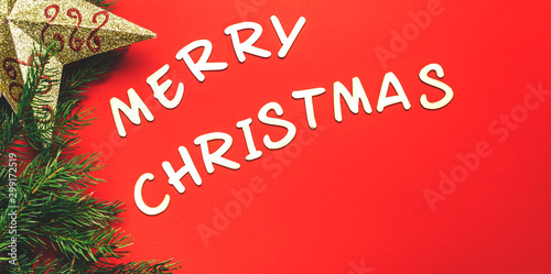 words of Merry christmas on red background.