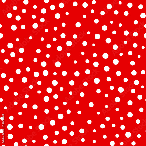 Random scattered polka dot pattern, abstract red and white background, white dots on red.