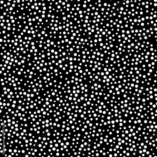 Random scattered polka dot pattern, abstract black and white background, white dots on black.