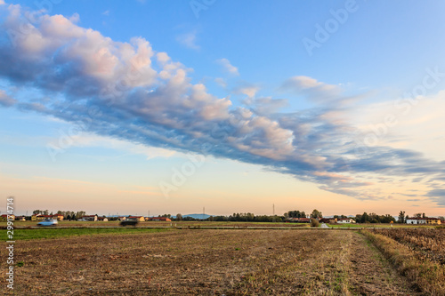 a rectilinear cloud/a rectilinear cloud formed at sunset in the countryside during the autumn photo