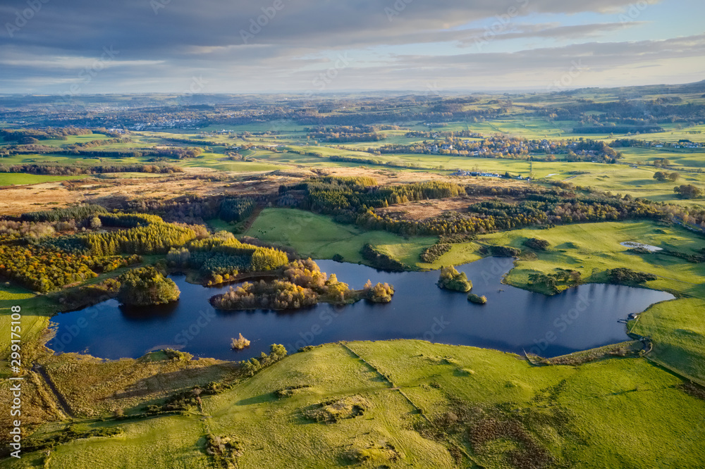 Aerial view over Knapps Loch in Kilmacolm during sunset