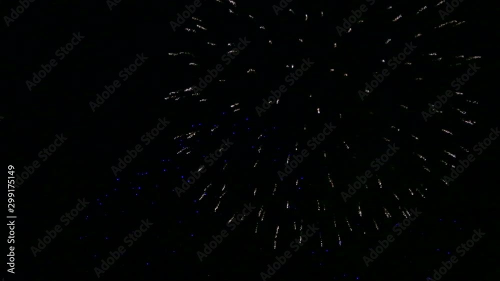 bright sparks of festive fireworks in the night sky above the river reflecting in the water bright sparks of festive fireworks in the night sky above the river reflecting in the water