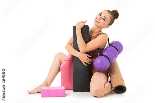 Young beautiful yoga woman is posing in studio photo