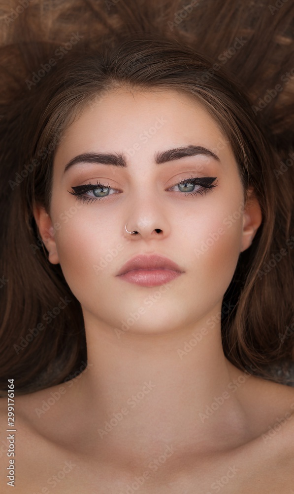 Portrait of a woman with clean and made-up skin Portrait of a woman with clean and made-up skin