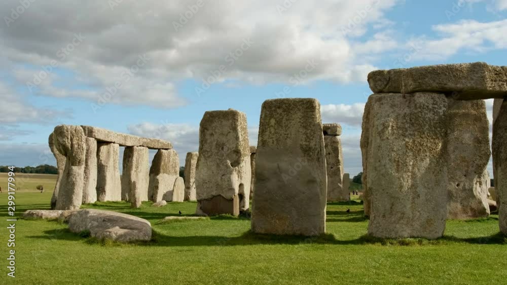 Tracking view of Stonehenge and Wiltshire Countryside in England, UK. The stone circle dates to 3000 BC and is one of the best known ancient wonders of the world and UNESCO World Heritage Site. Tracking view of Stonehenge and Wiltshire Countryside in England, UK. The stone circle dates to 3000 BC and is one of the best known ancient wonders of the world and UNESCO World Heritage Site.
