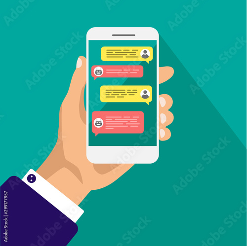 Chat bot concept. Hand holds smartphone with dialog boxes. Flat design of messaging bubbles. Chatting between robot and human. Vector illustration isolated on green background.