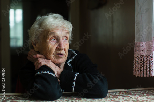 Portrait of a sad old lady. Care for lonely pensioners.