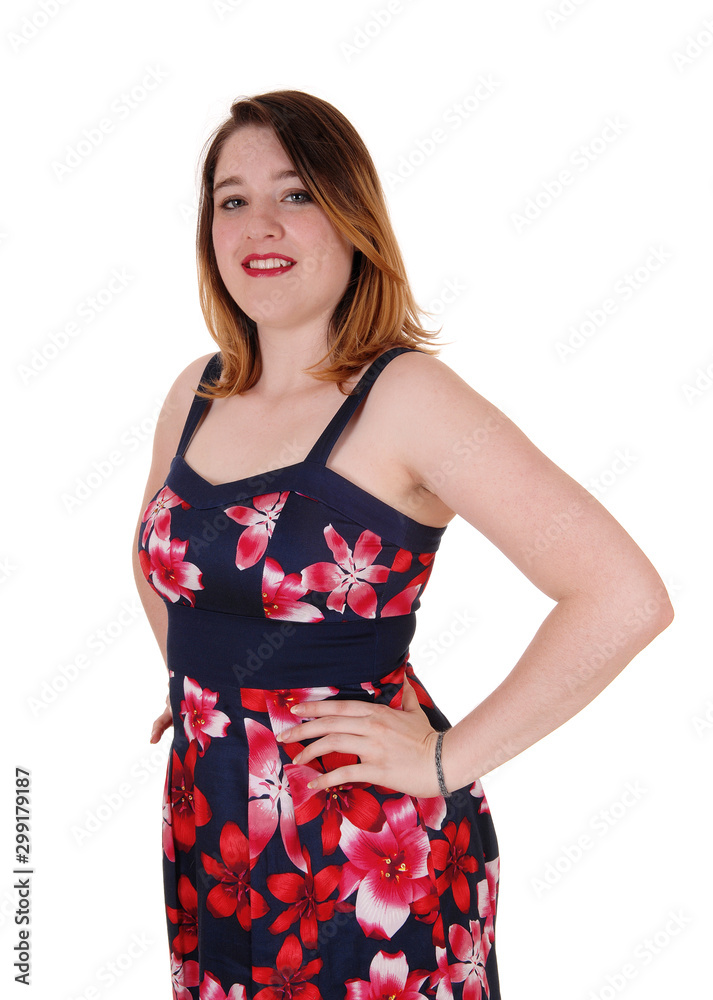 Pretty woman standing in colorful dress Pretty woman standing in colorful dress