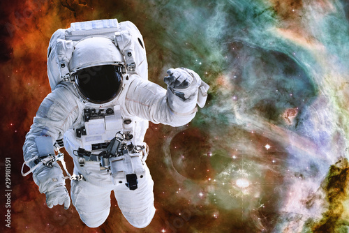 Fototapeta Naklejka Na Ścianę i Meble -  Astronaut somewhere in deep space. Elements of this image were furnished by NASA