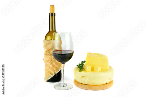 Bottle with glass of wine and cheese isolated on white background