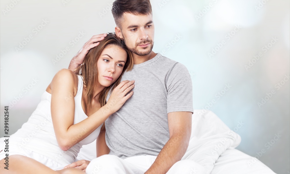 Young couple in bed. Young couple in bed.